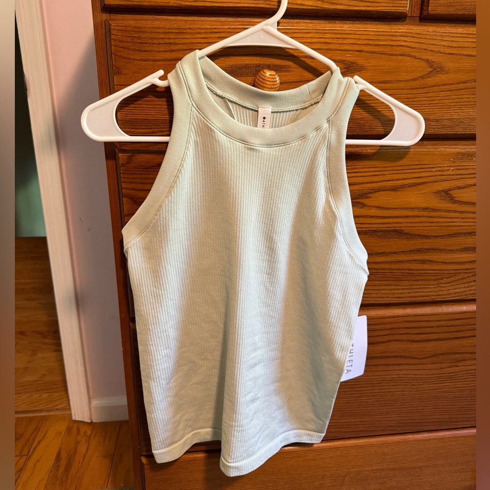 NWT. Athleta Renew Seamless Racerback Tank size small. Light green color.